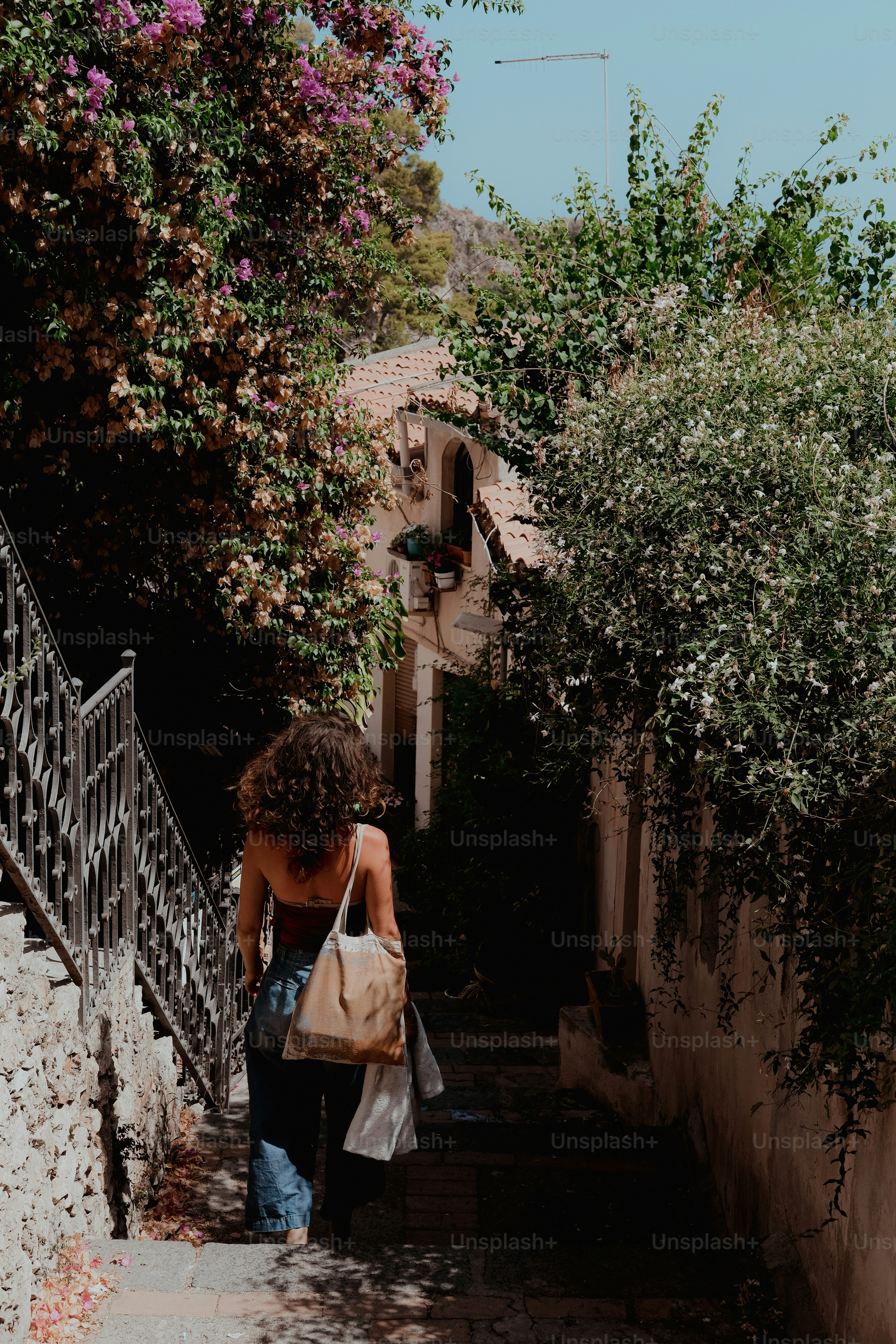 a woman walking up a set of stairs