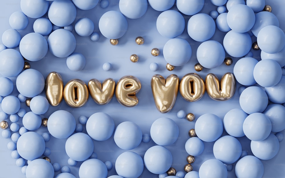 the word love you spelled out of balloons