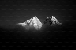 a black and white photo of a mountain range