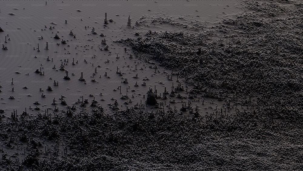 uma foto em preto e branco de areia e água