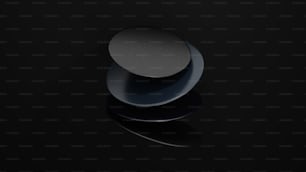 a black surface with a round object on top of it