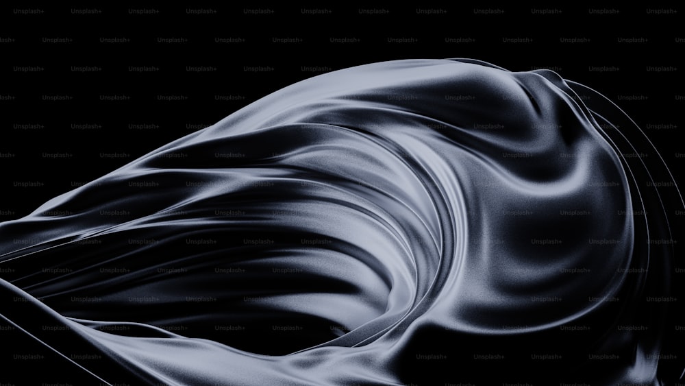 a black and white photo of a wavy fabric