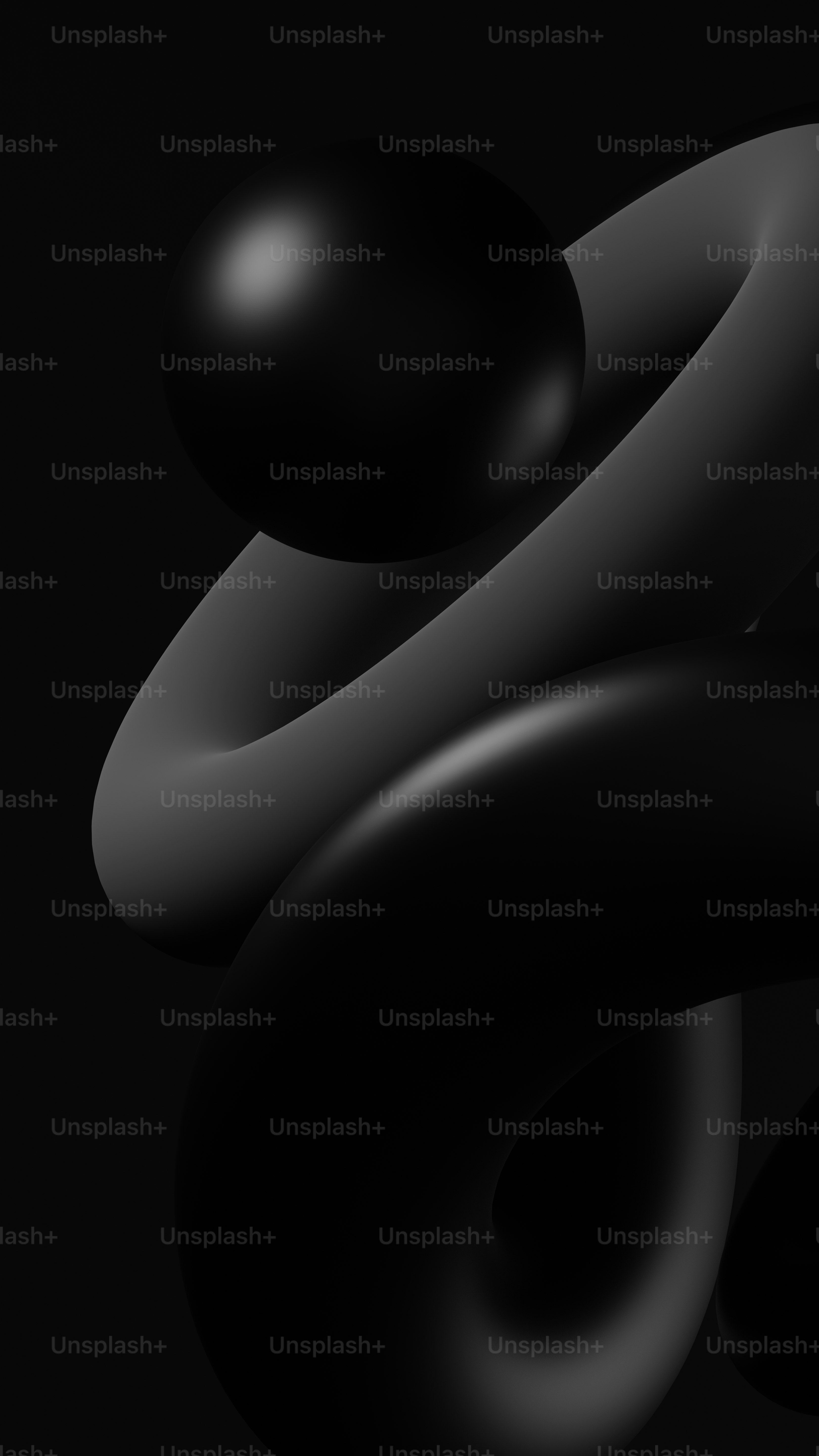 a black background with a black object in the middle