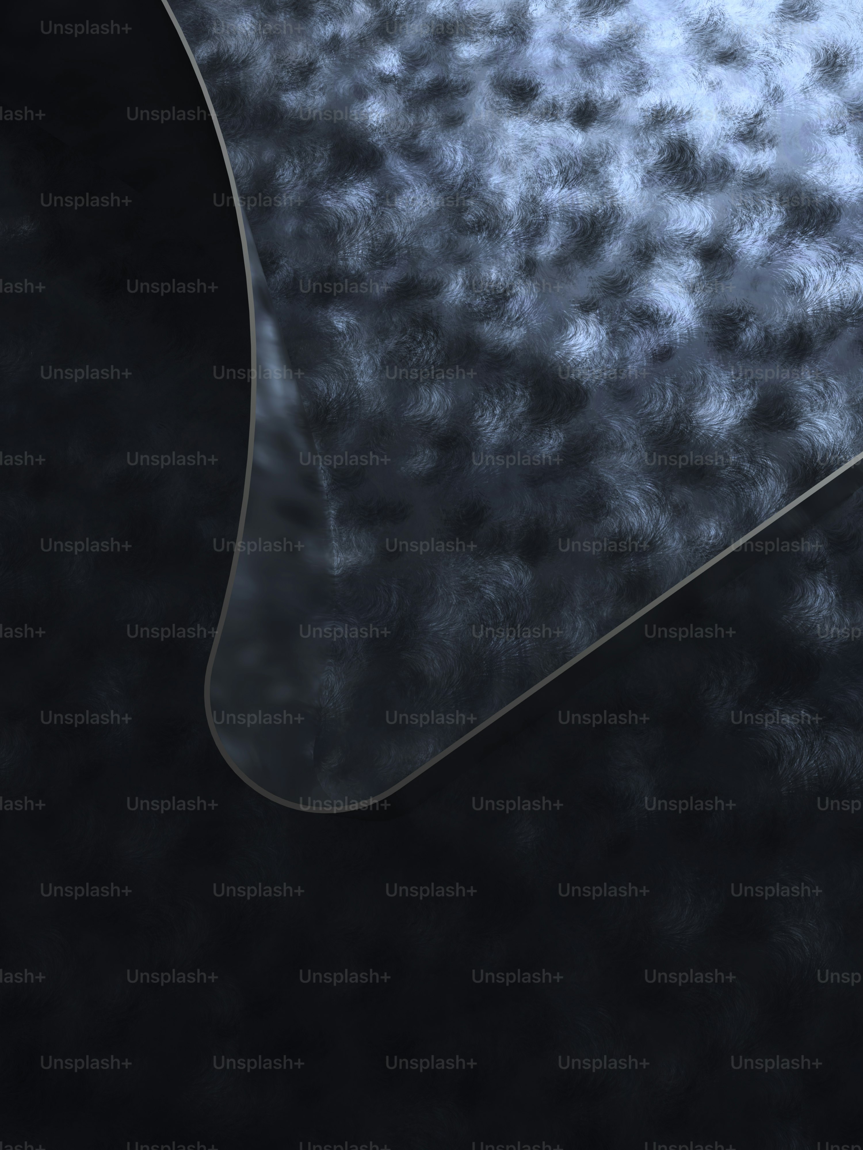 a close up of a black and silver surface