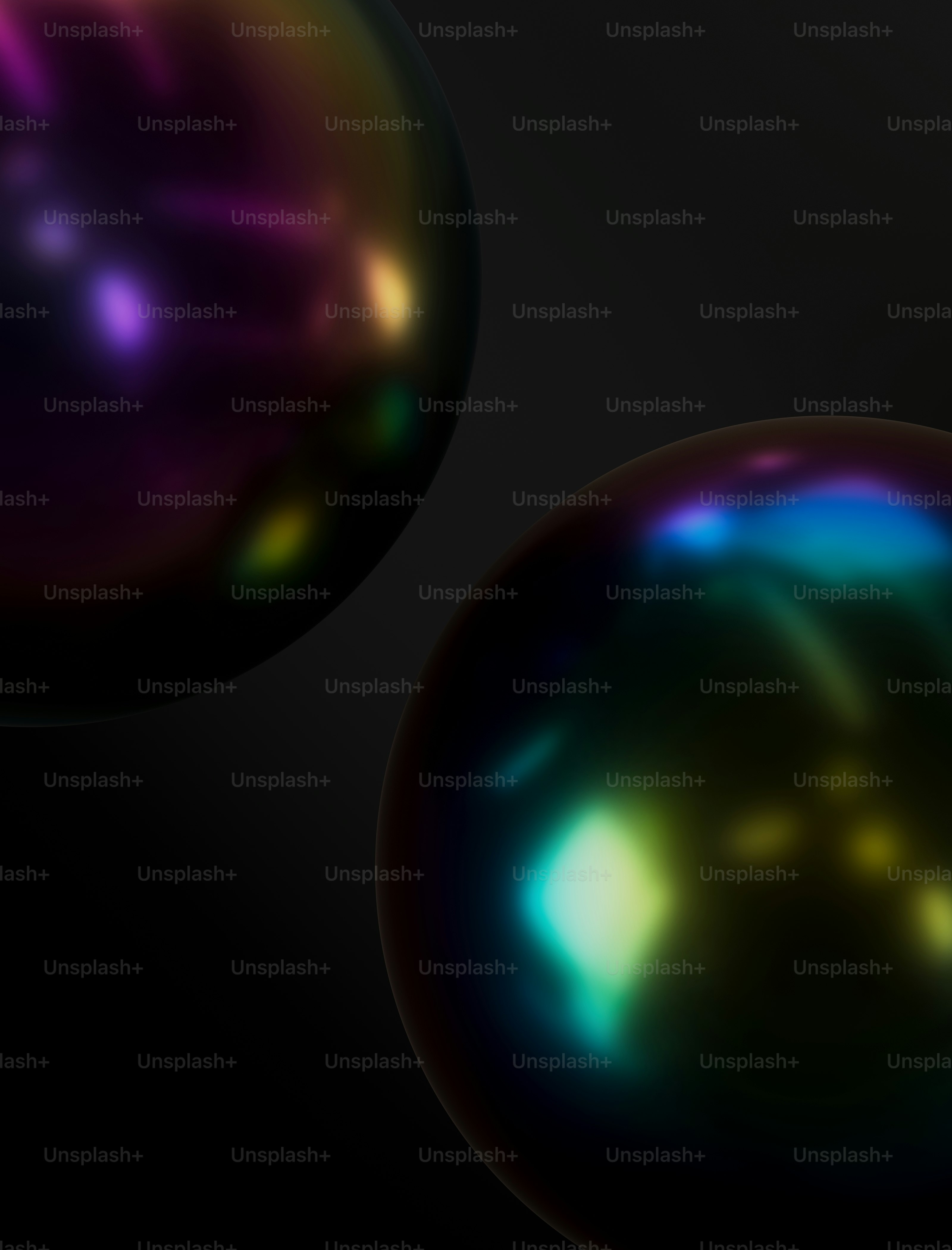 two shiny balls on a black background