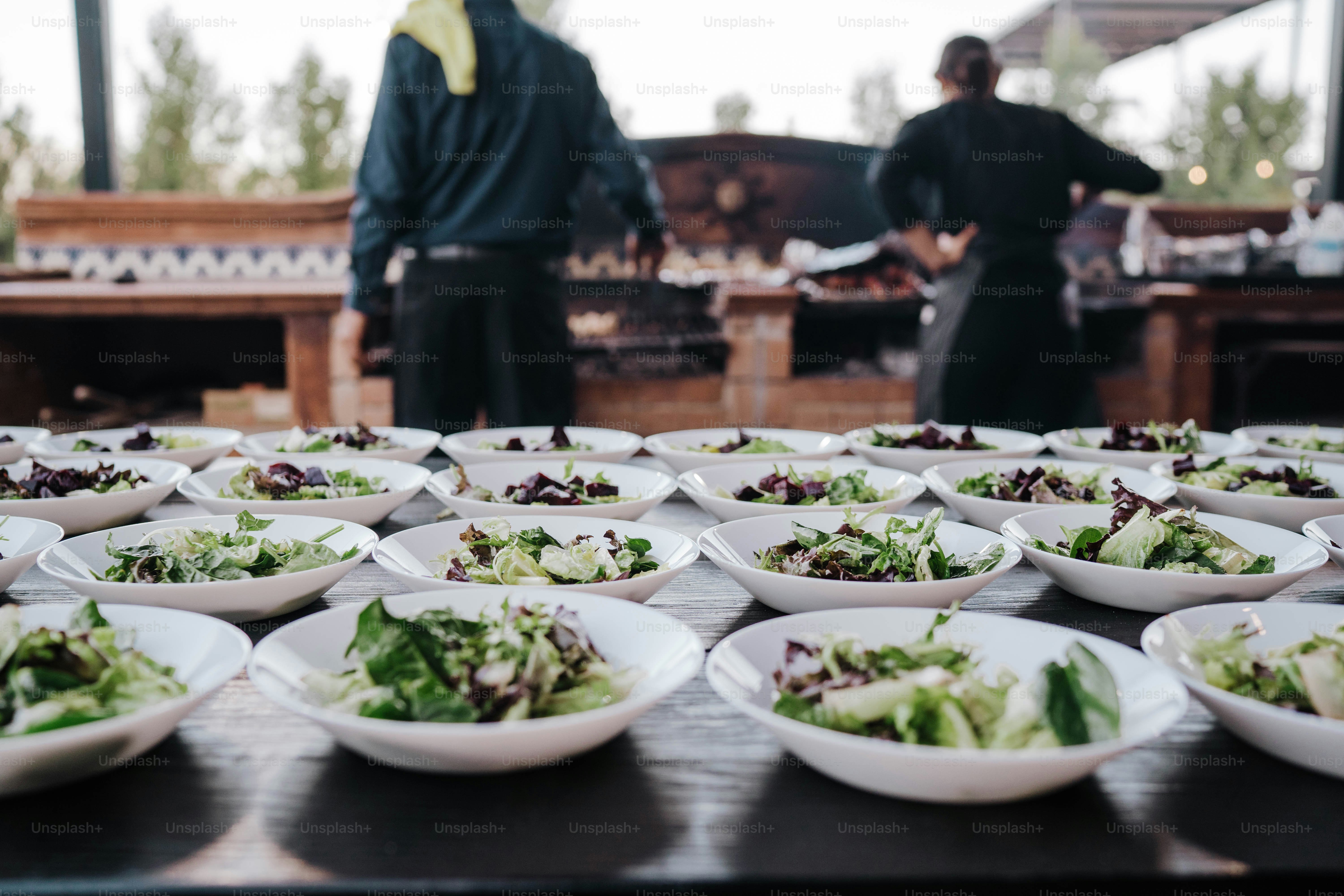 a table topped with lots of plates of food