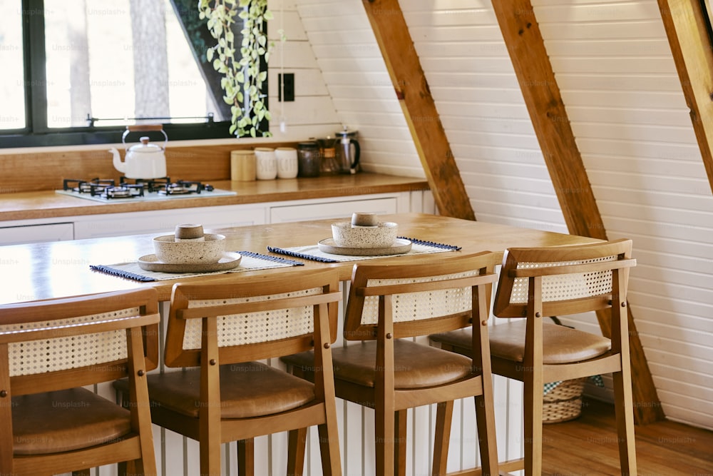 a kitchen with a table and four chairs