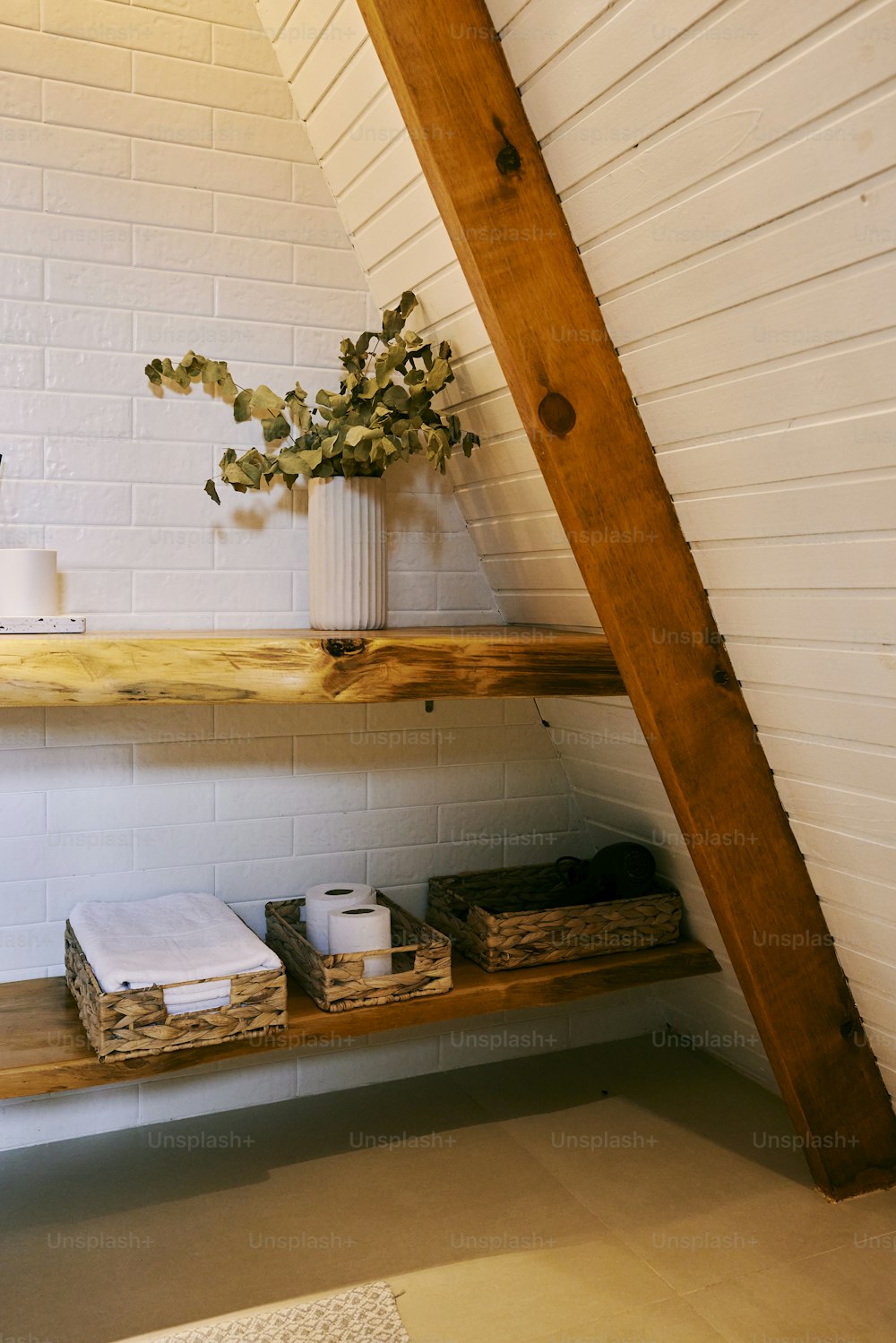 a shelf with a vase of flowers on it