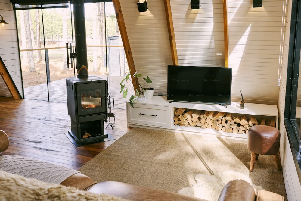 a living room with a fireplace and a television