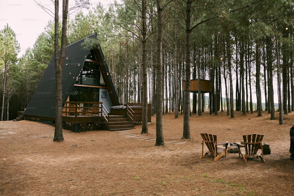 a tent set up in the middle of a forest