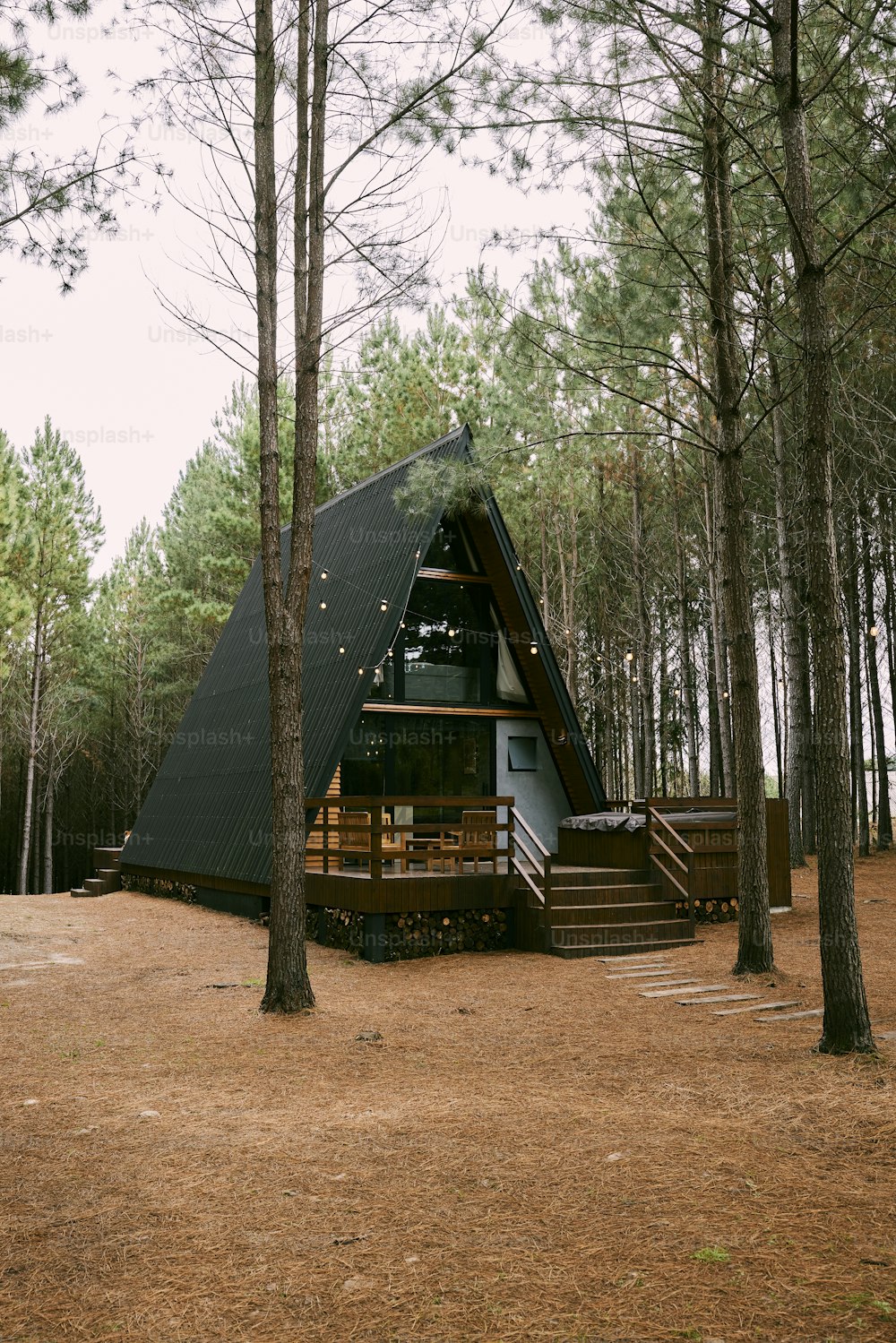 a small cabin in the middle of a forest