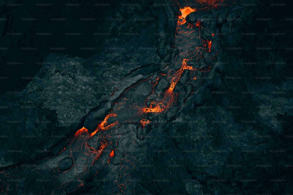 an aerial view of lava in the ocean