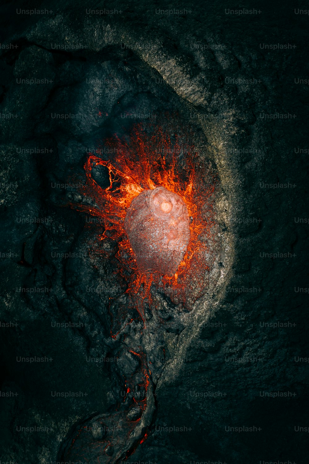an aerial view of a lava with a red light