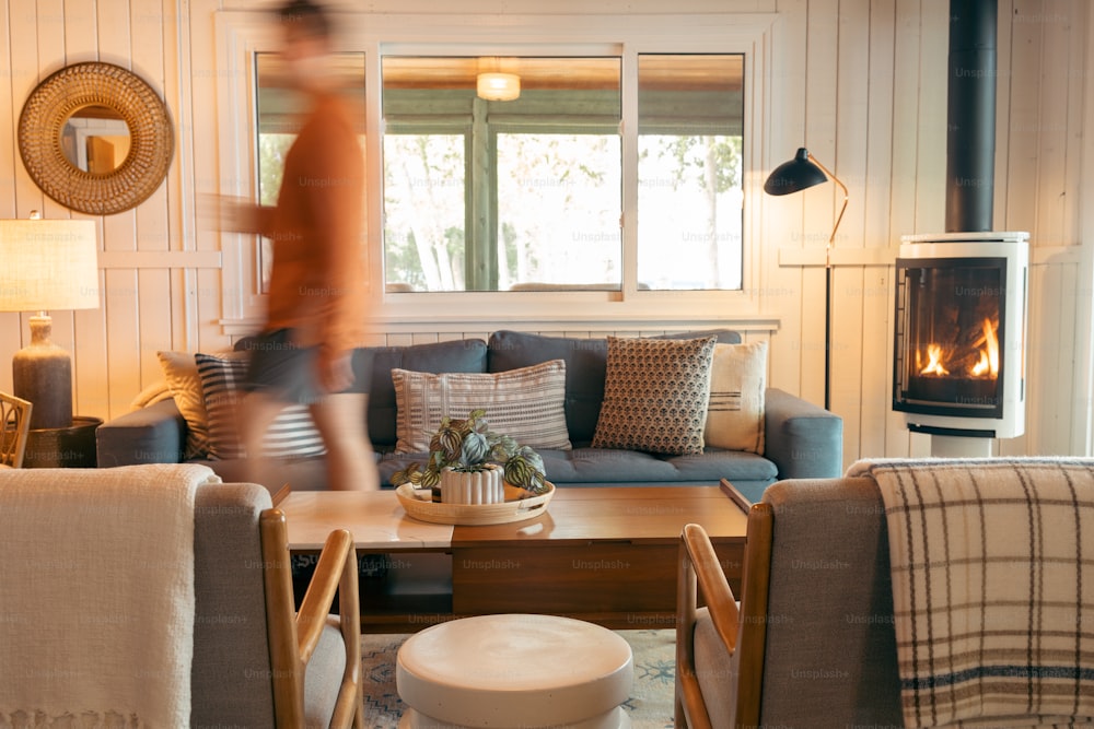 a living room filled with furniture and a fire place