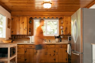 a blurry image of a person in a kitchen