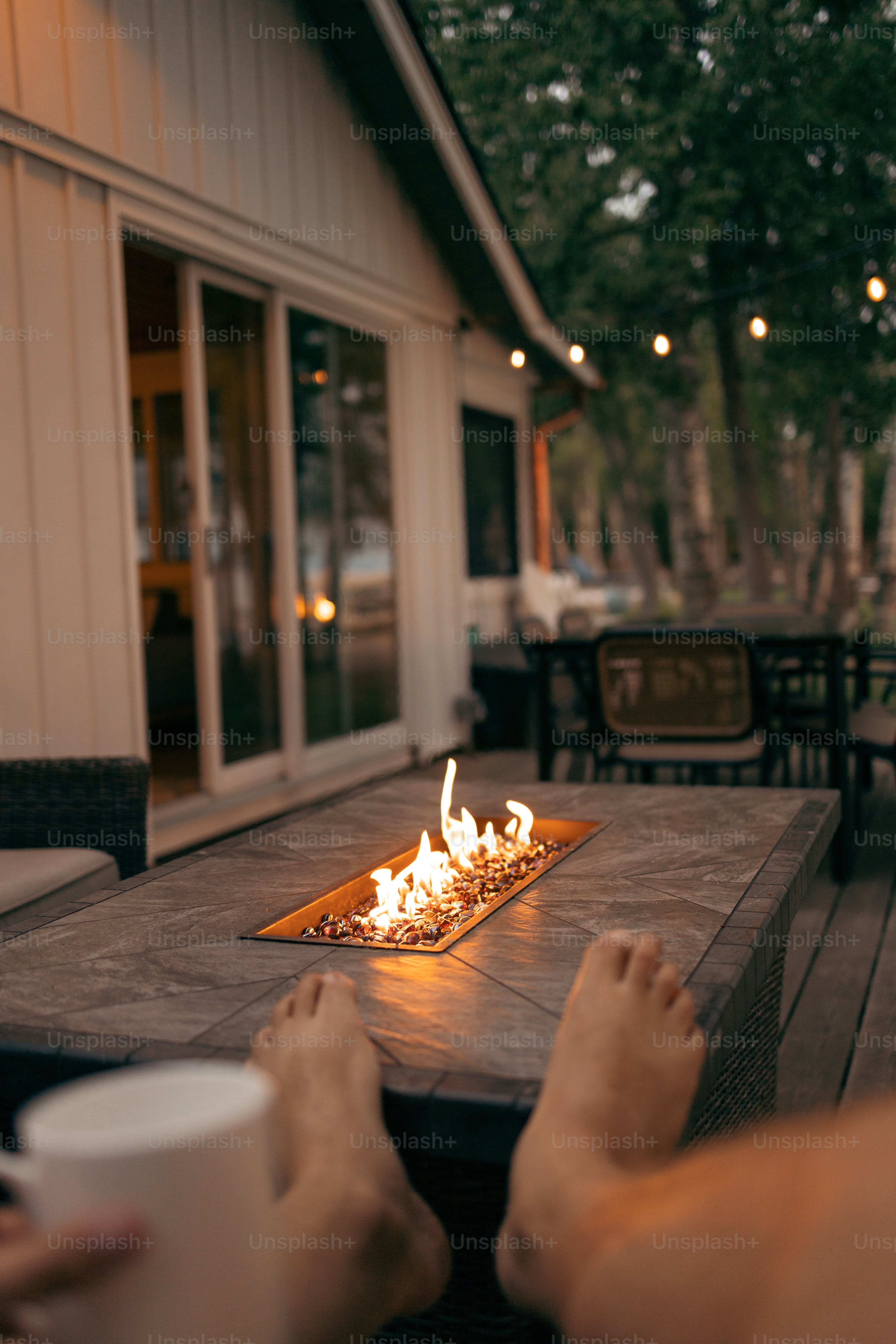 Outdoor fire pit at dusk with cozy seating