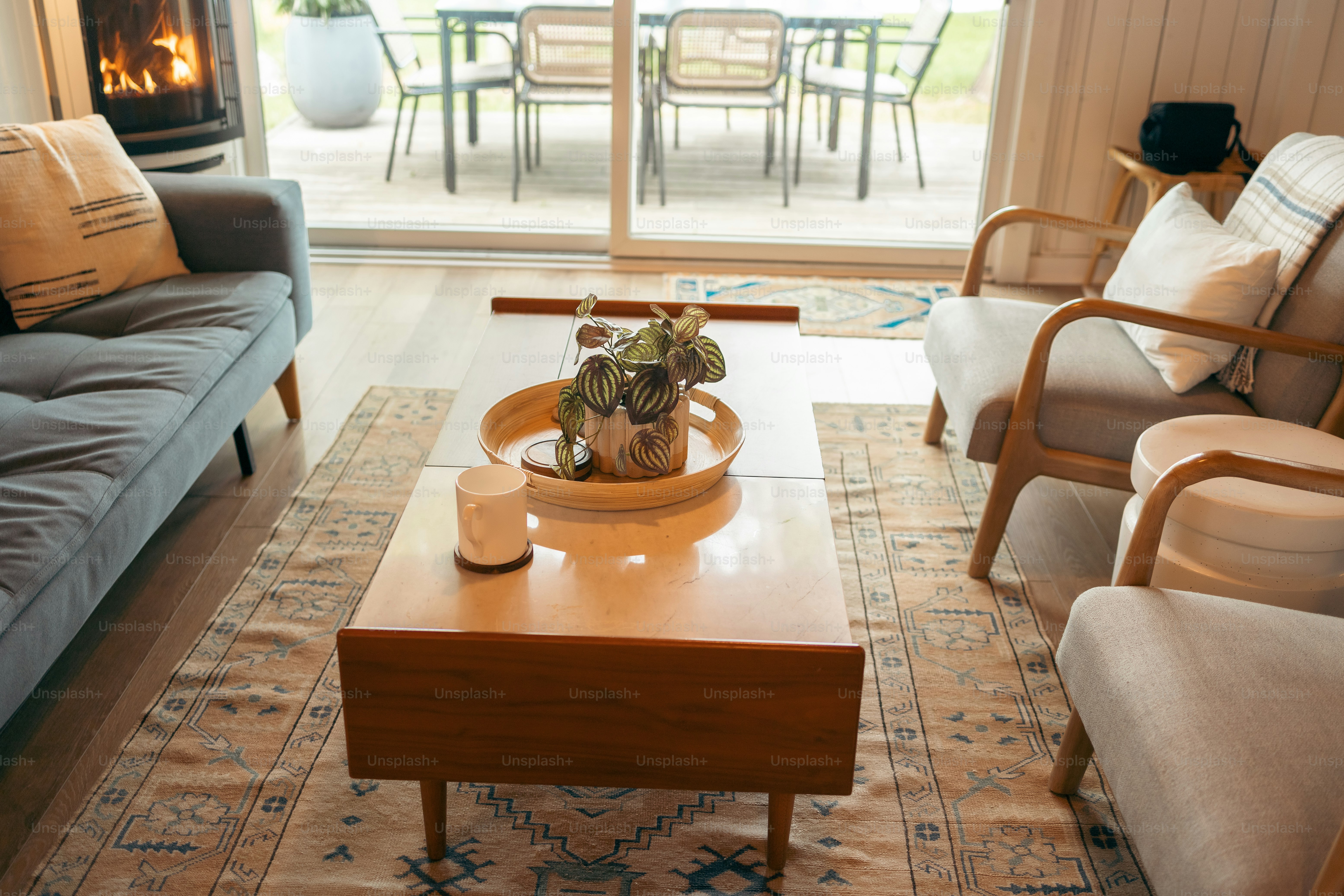 a living room filled with furniture and a fire place