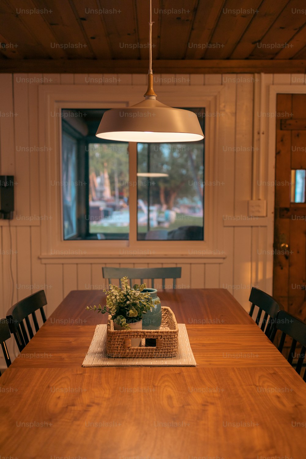 a wooden table with a basket on top of it