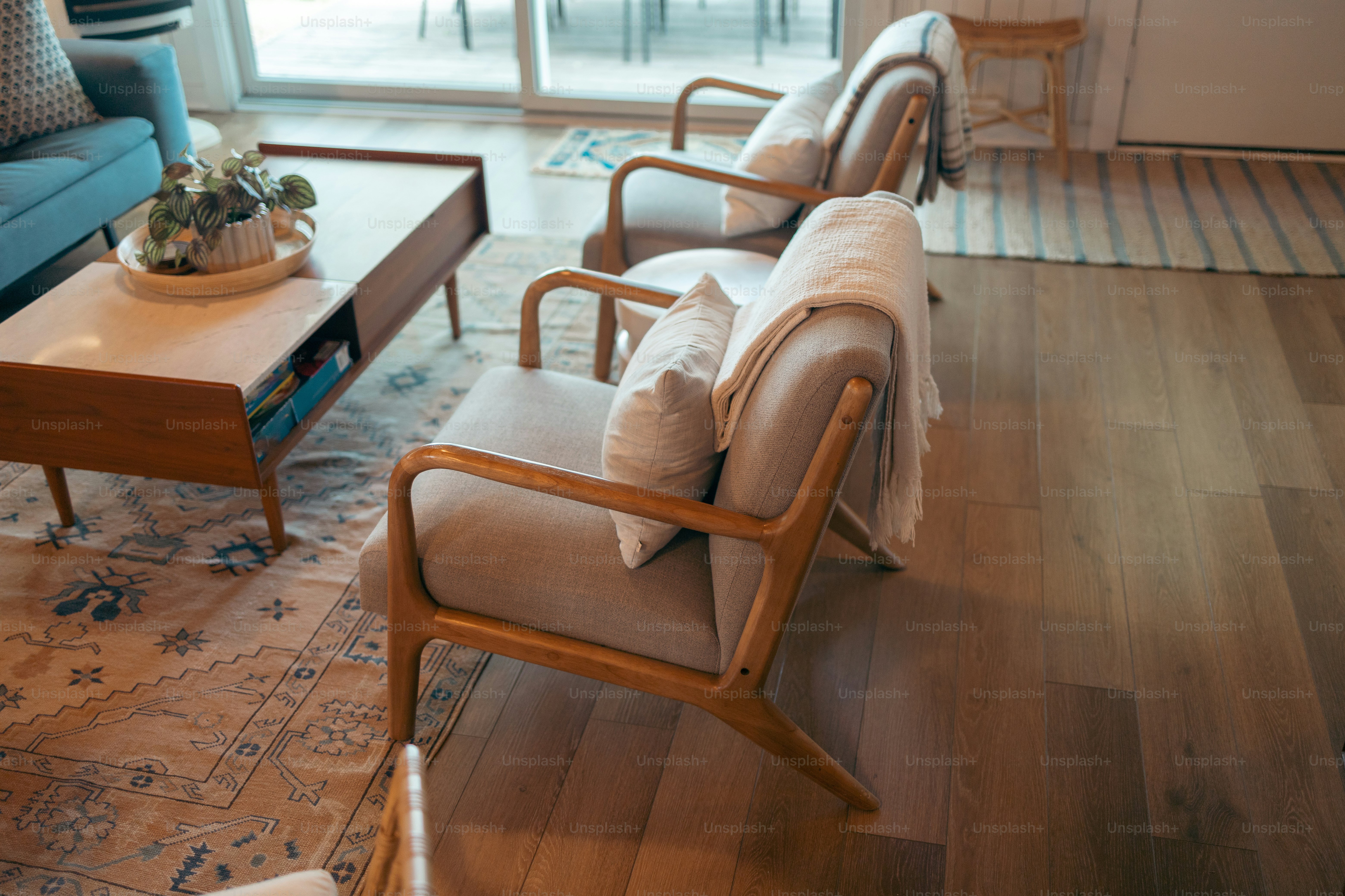 a living room filled with furniture and a large window