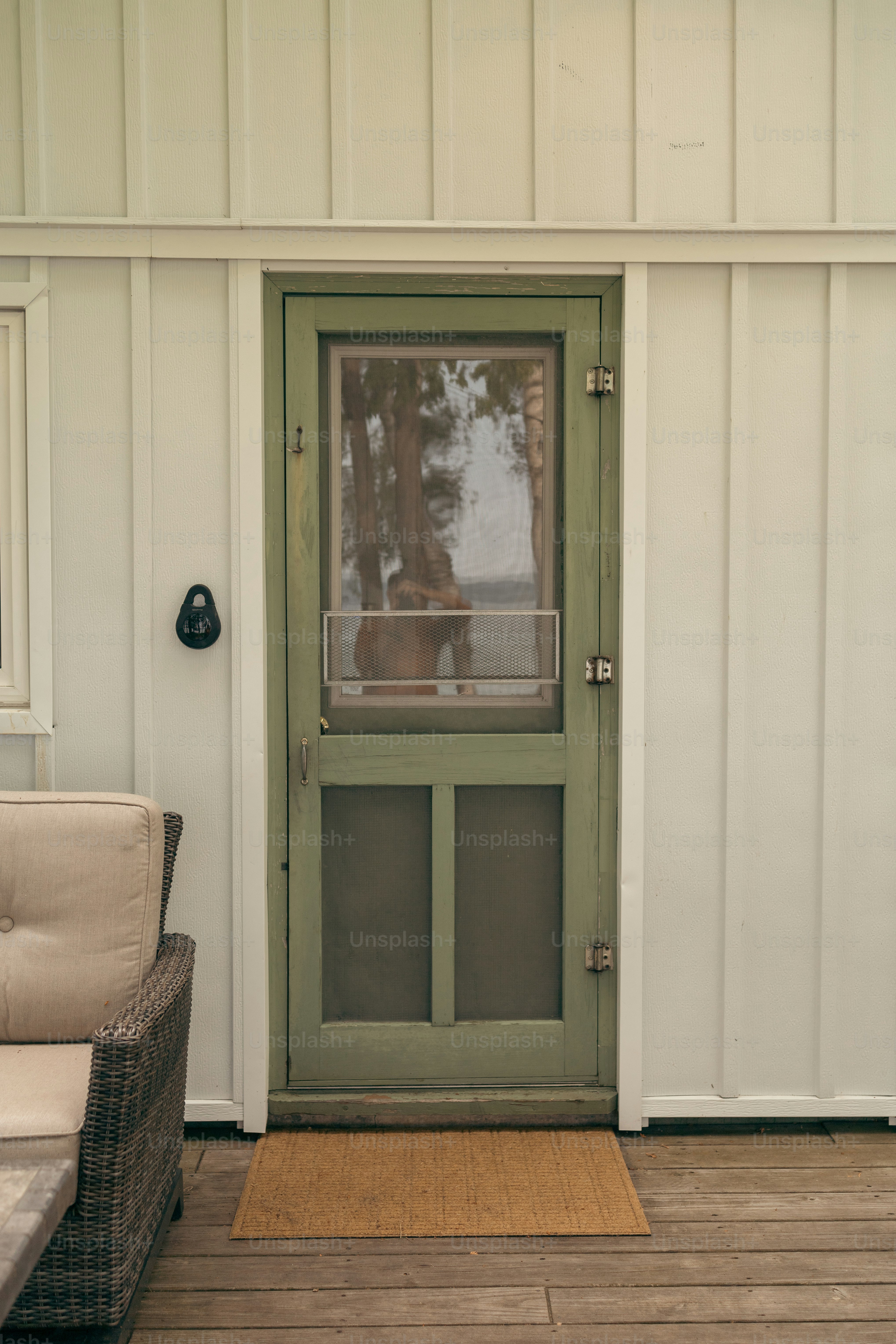 a dog is looking out the window of a house