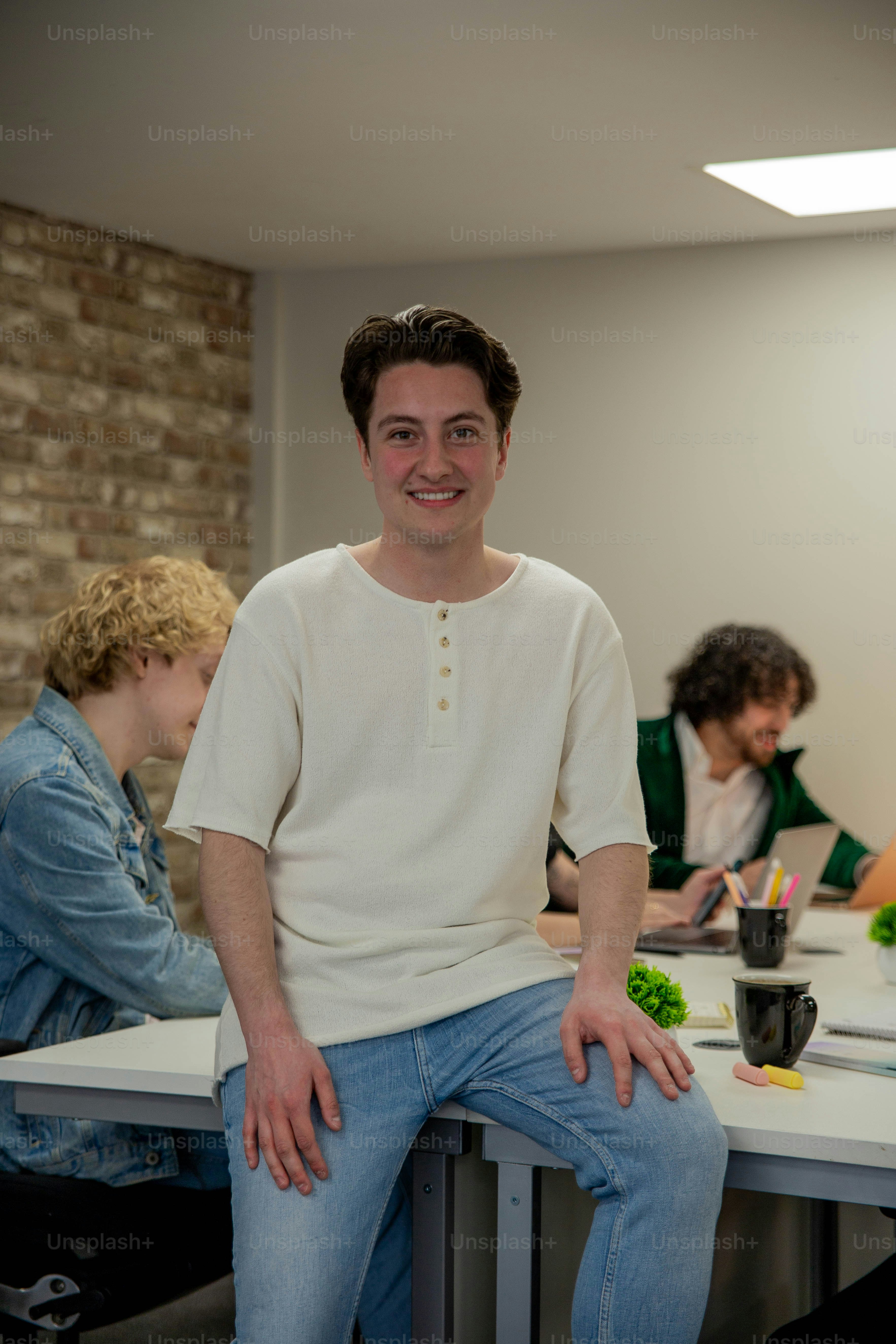 a man sitting on a table in a room