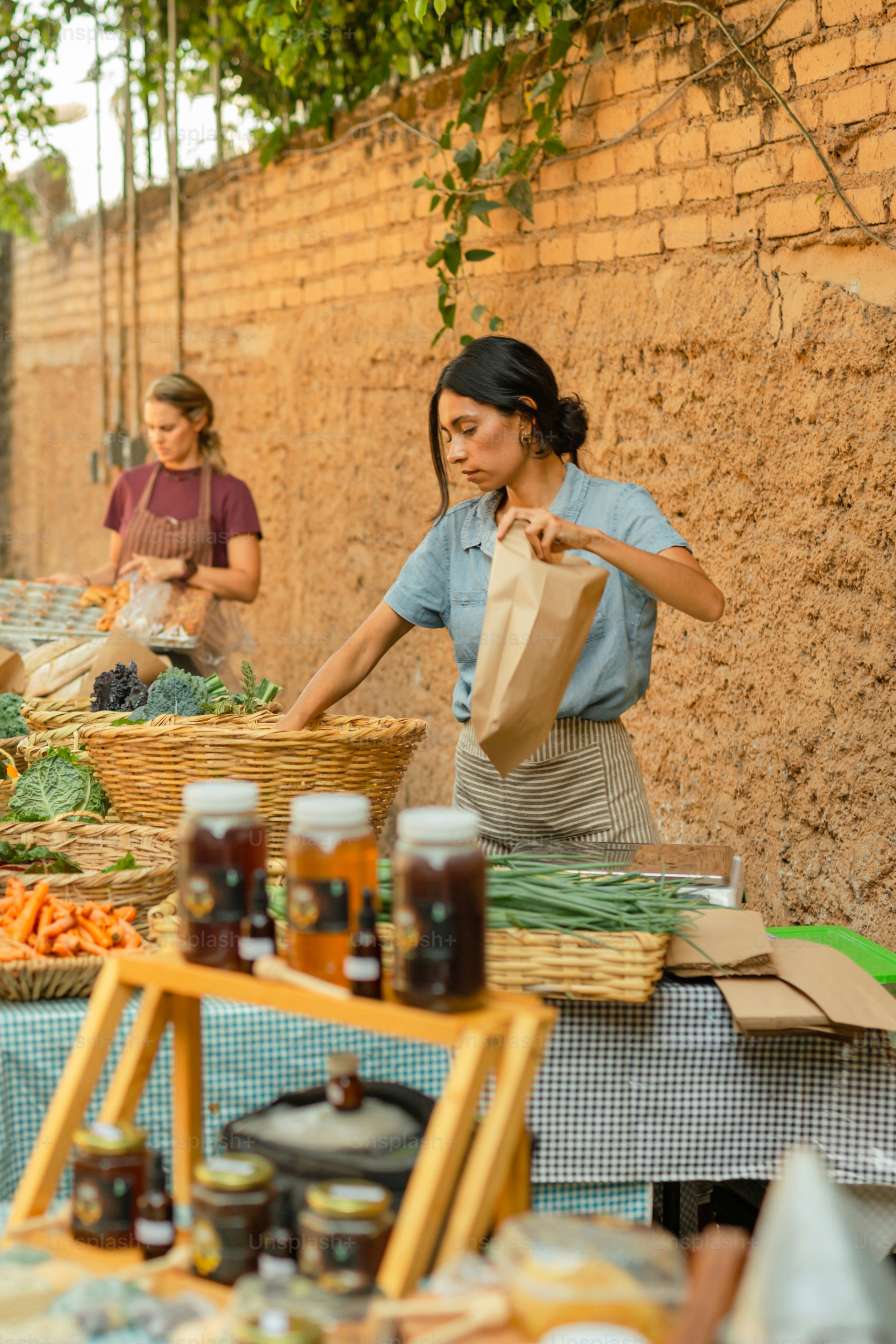 a woman standing next to a table filled with food