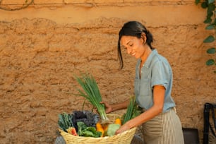a woman holding a basket full of vegetables