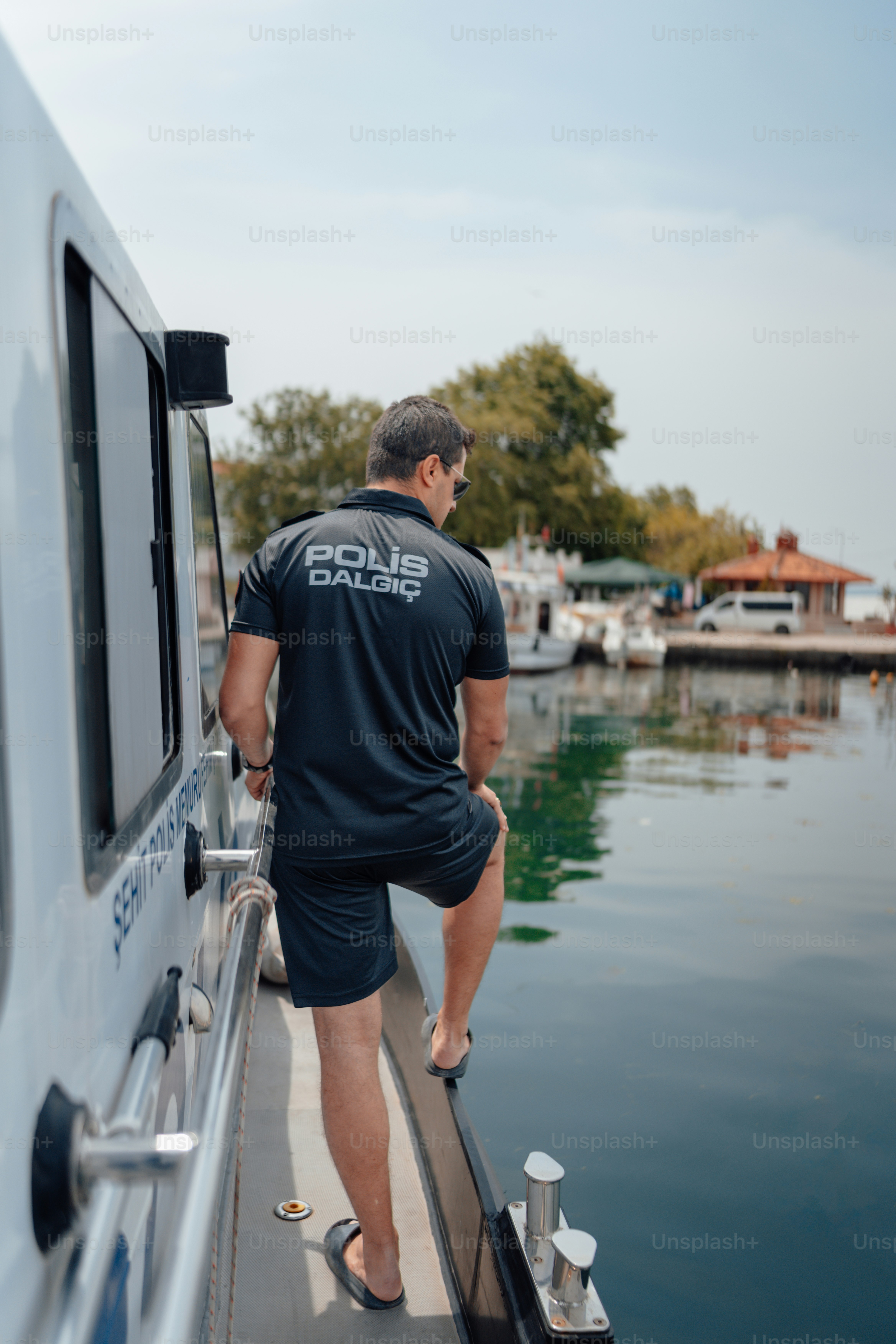 a man standing on a boat in the water