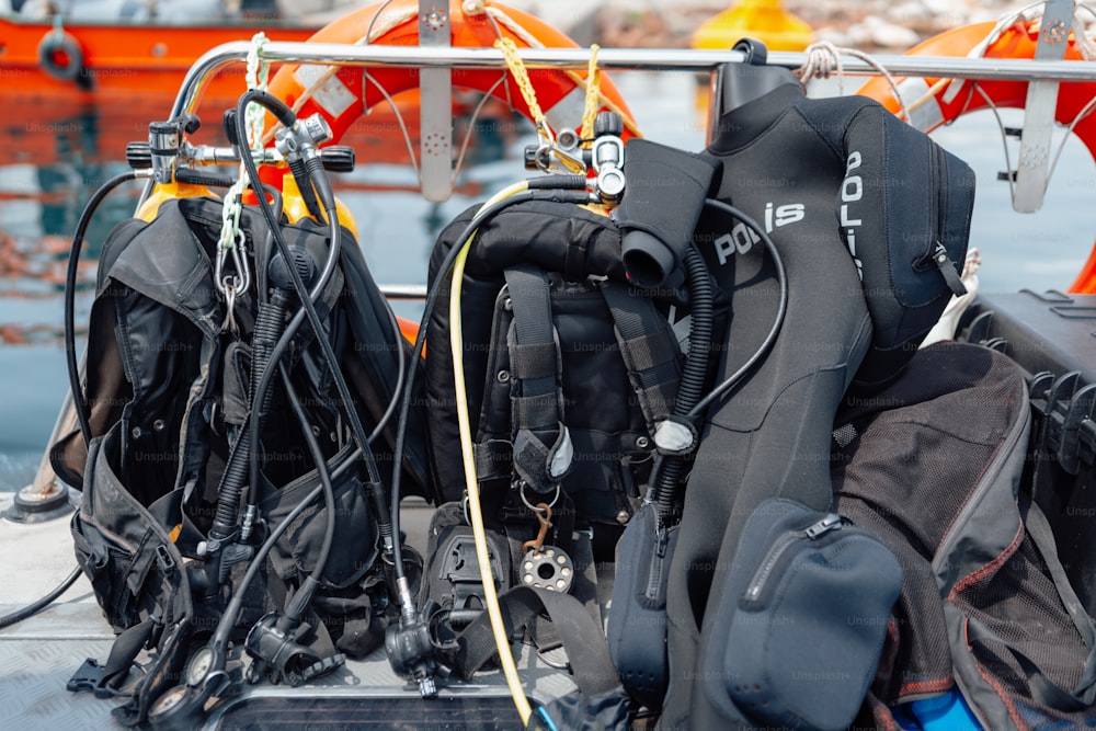 scuba gear are sitting on the back of a boat