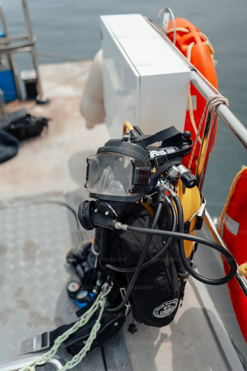 a camera and a scuba equipment on a boat