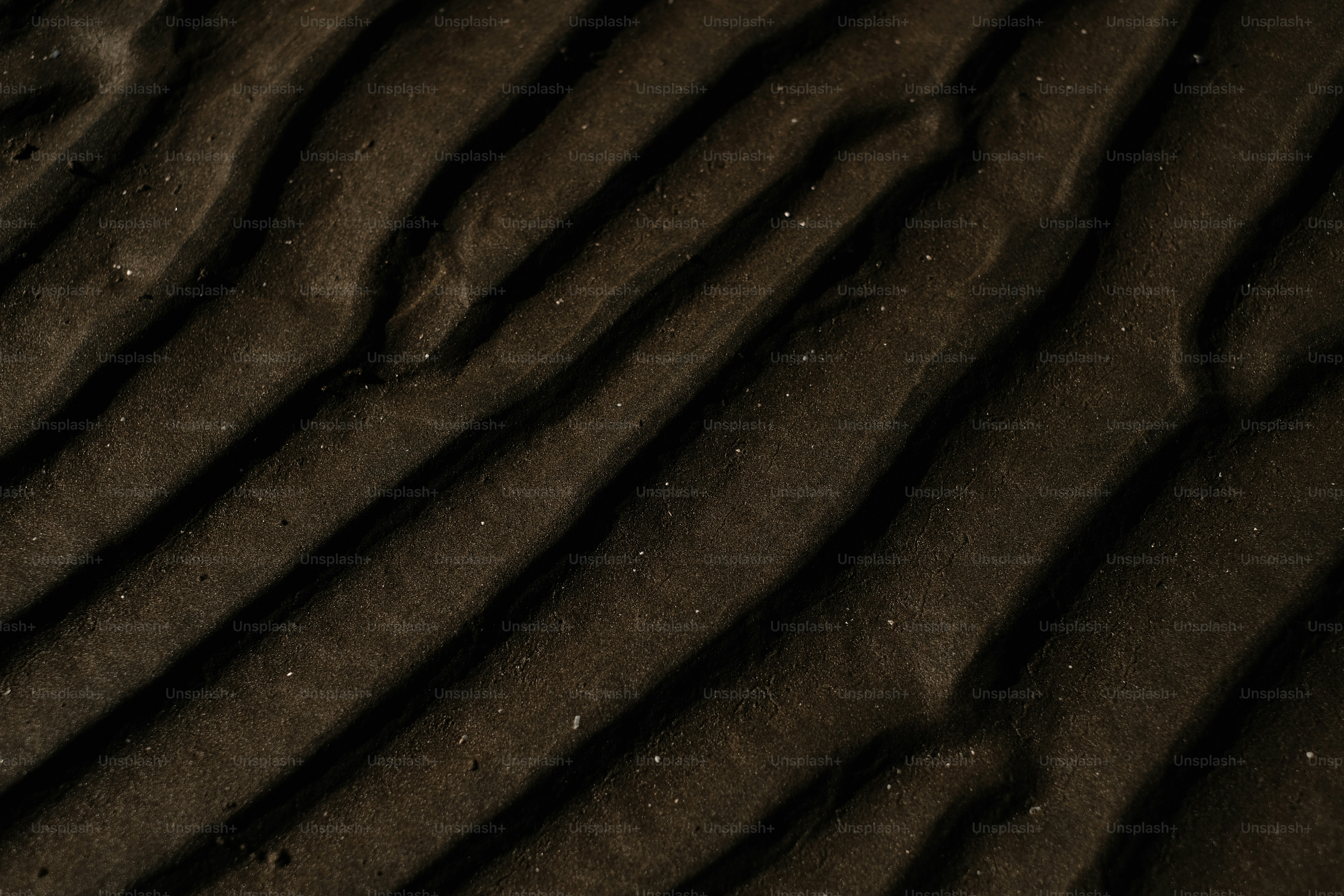 a close up view of sand and water