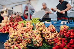 a bunch of baskets filled with lots of fruit