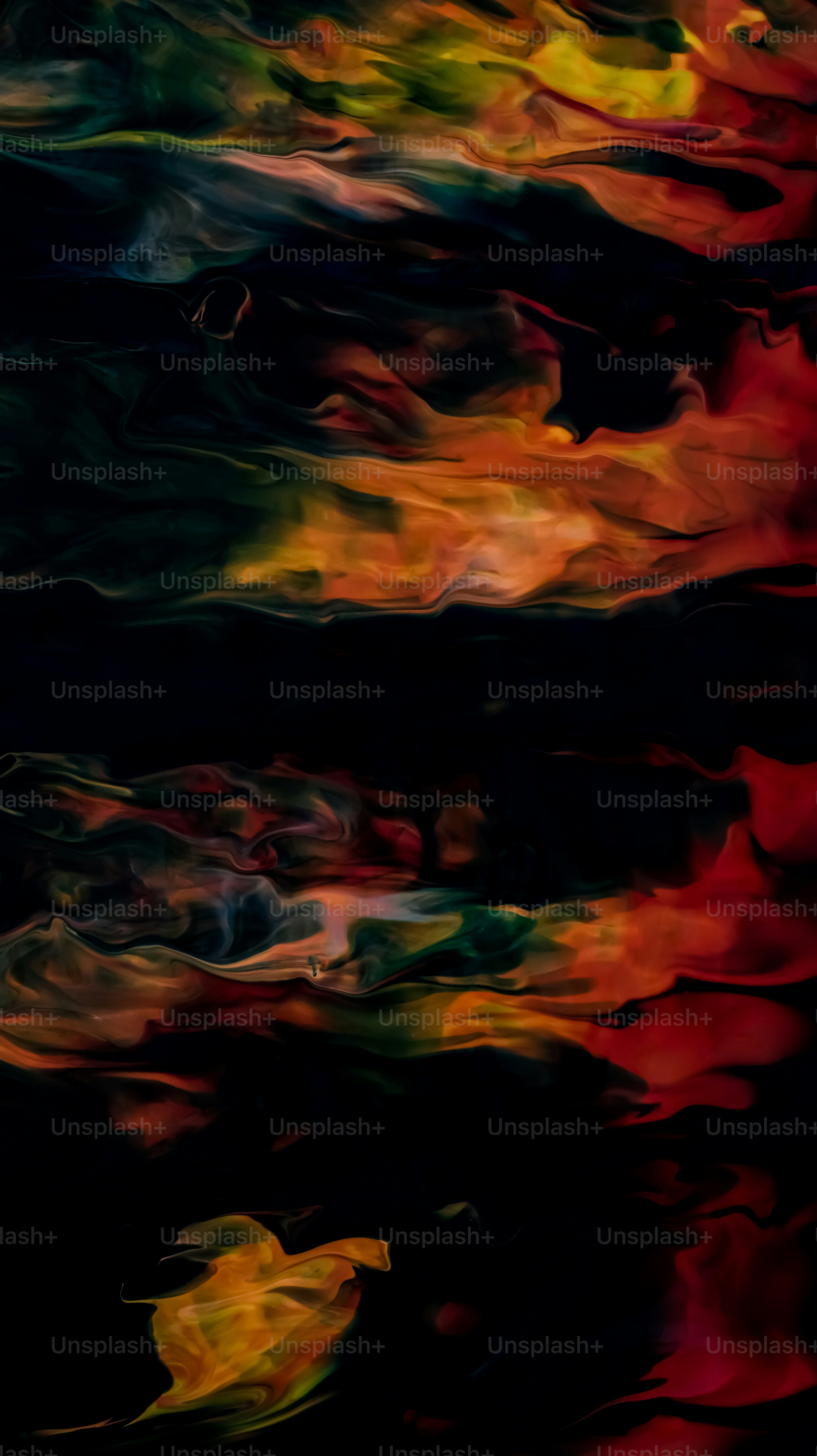 a black background with red, yellow, and green colors