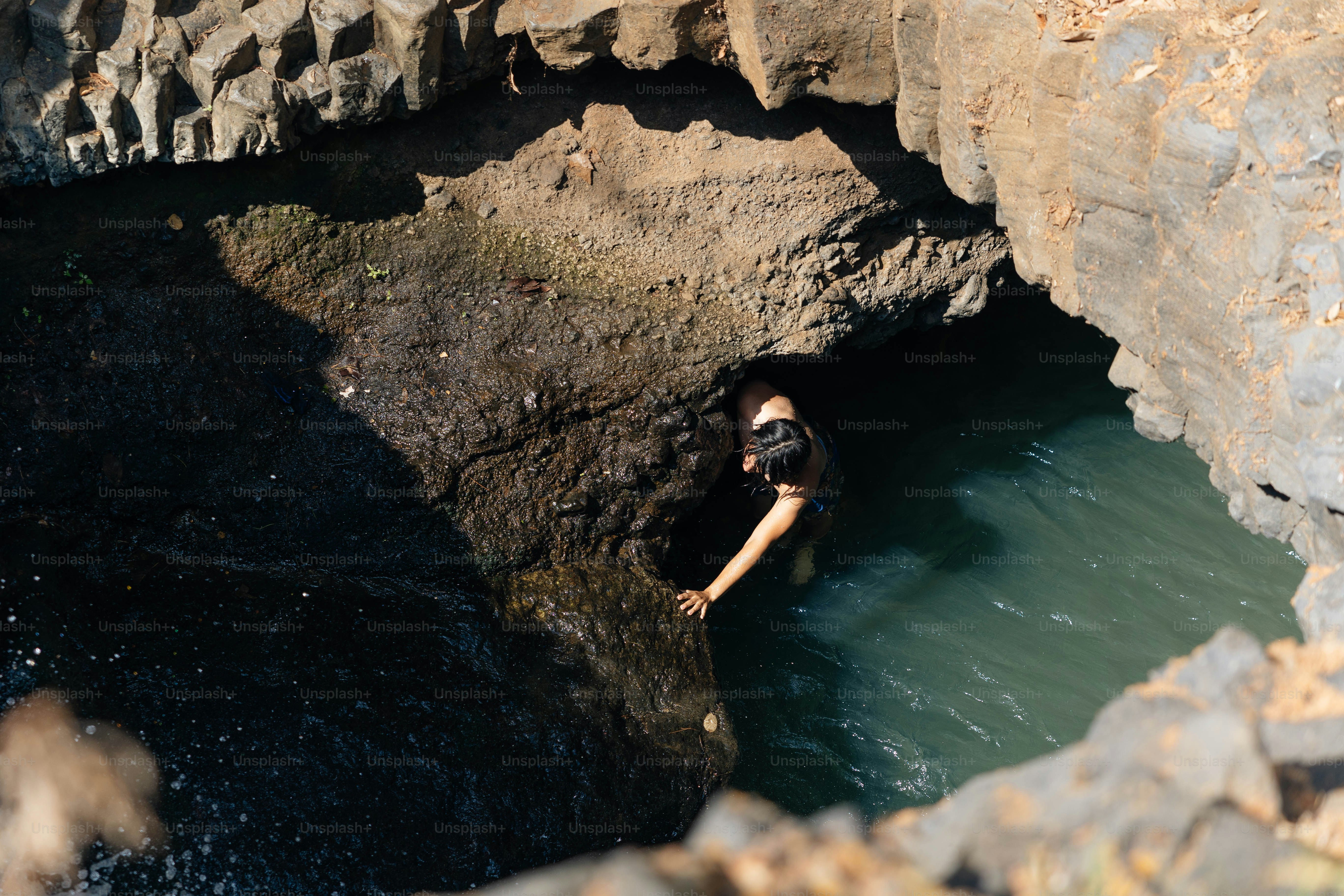 a man is swimming in a pool of water