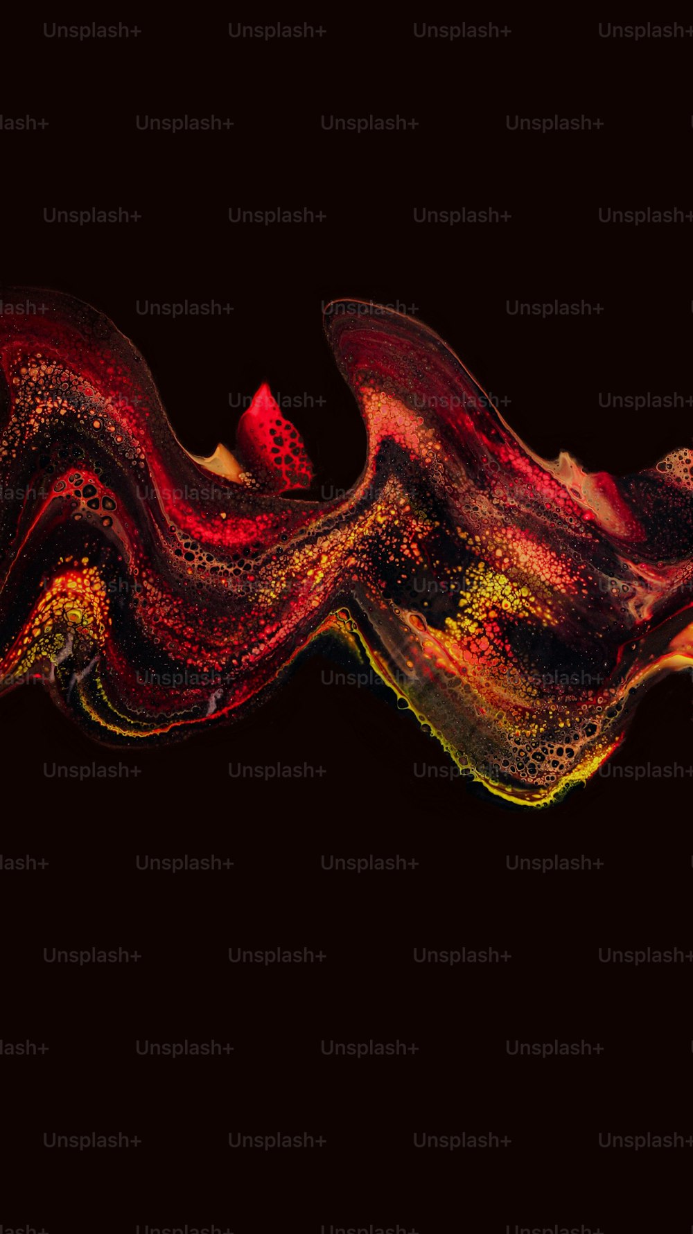 a red and yellow swirl on a black background
