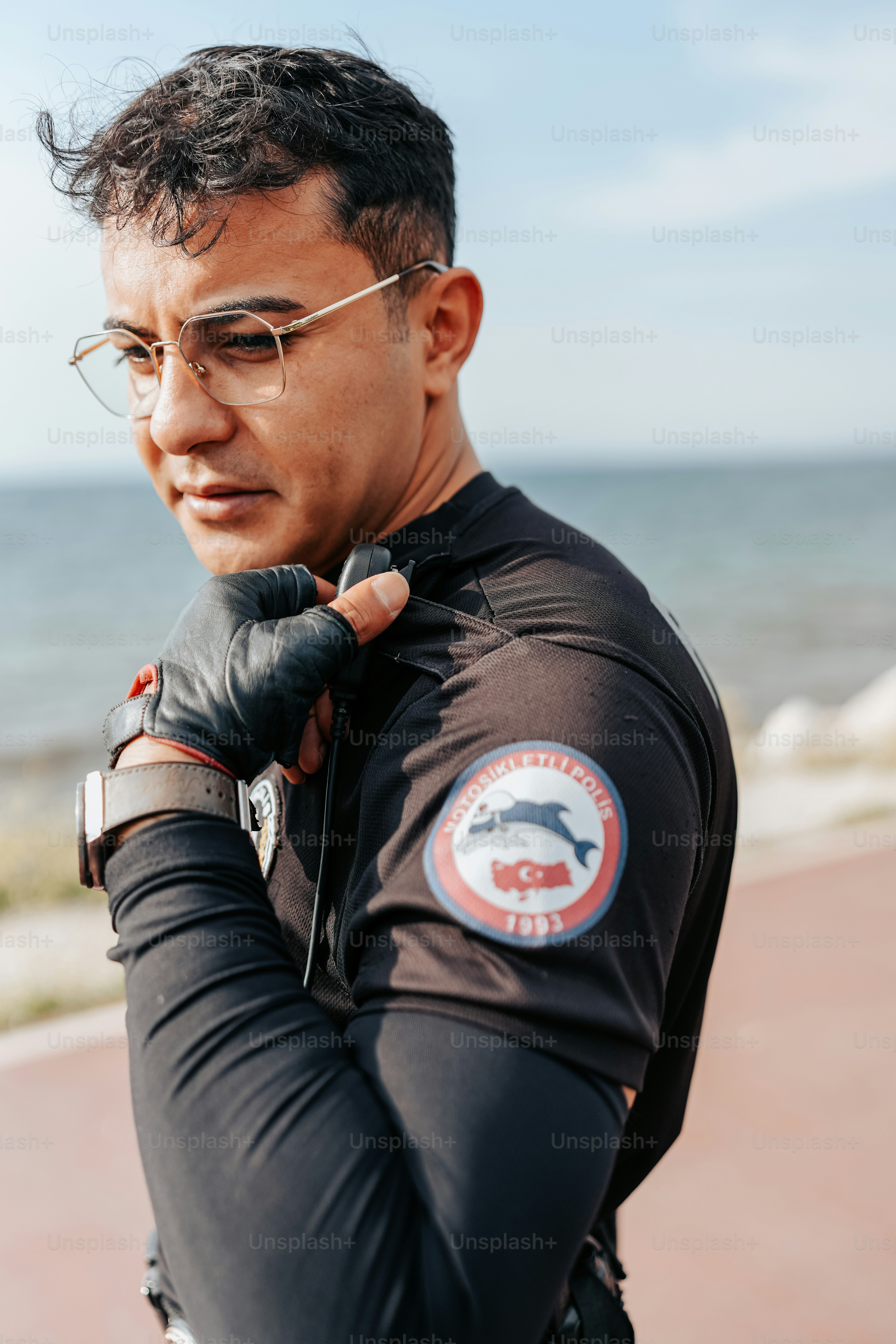 a man wearing a black shirt and glasses