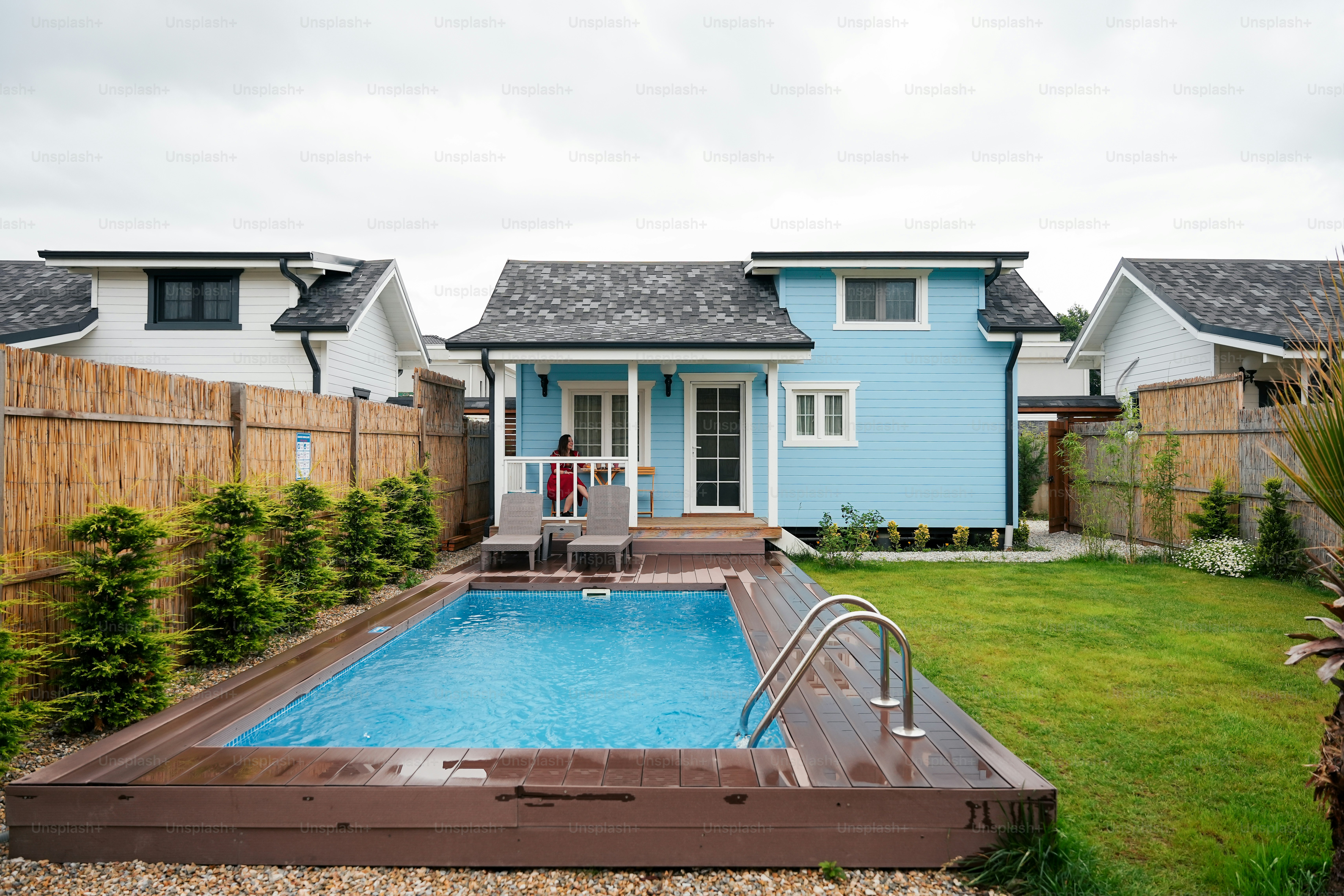 a backyard with a pool and a fence