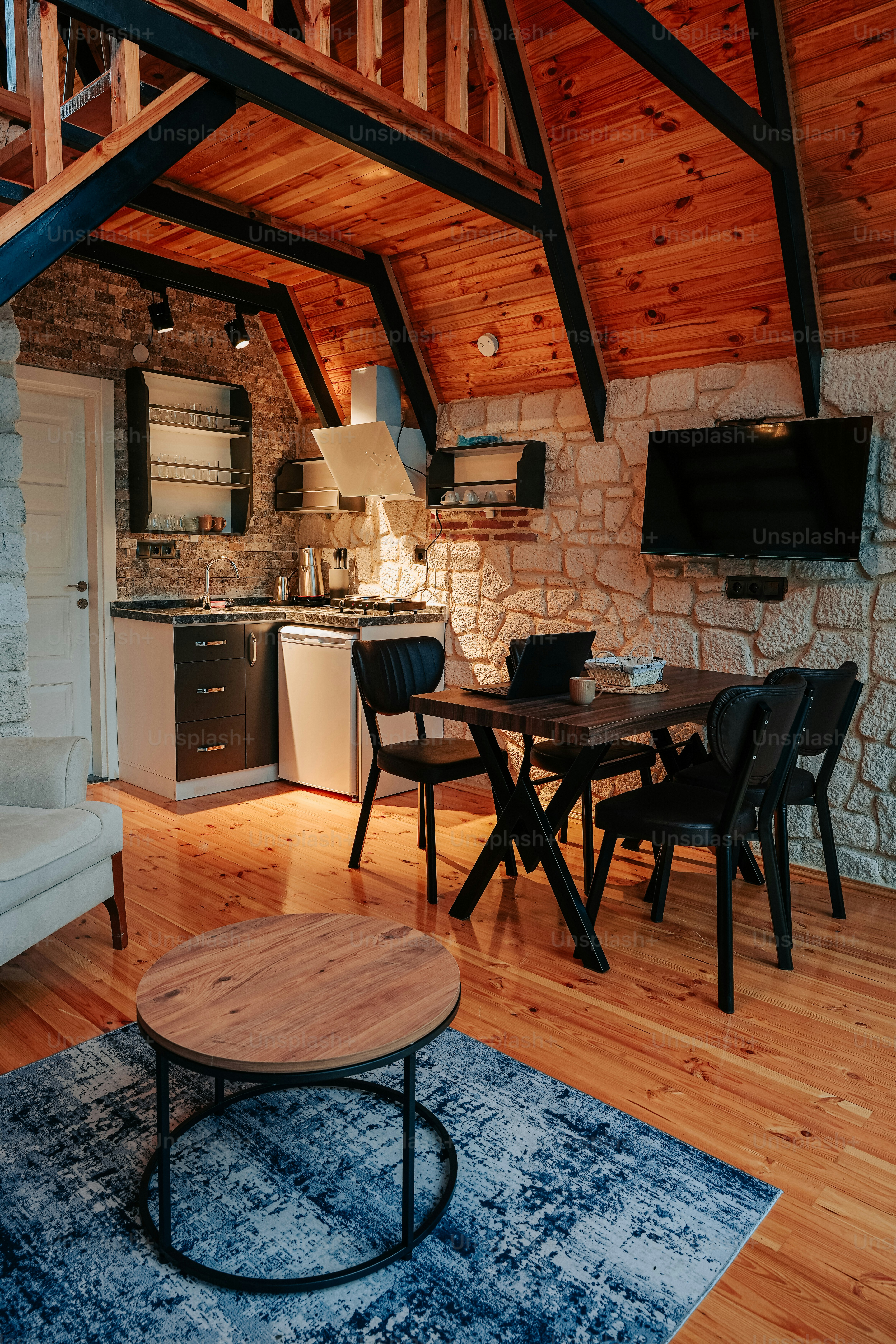 a living room with a couch a table and a tv
