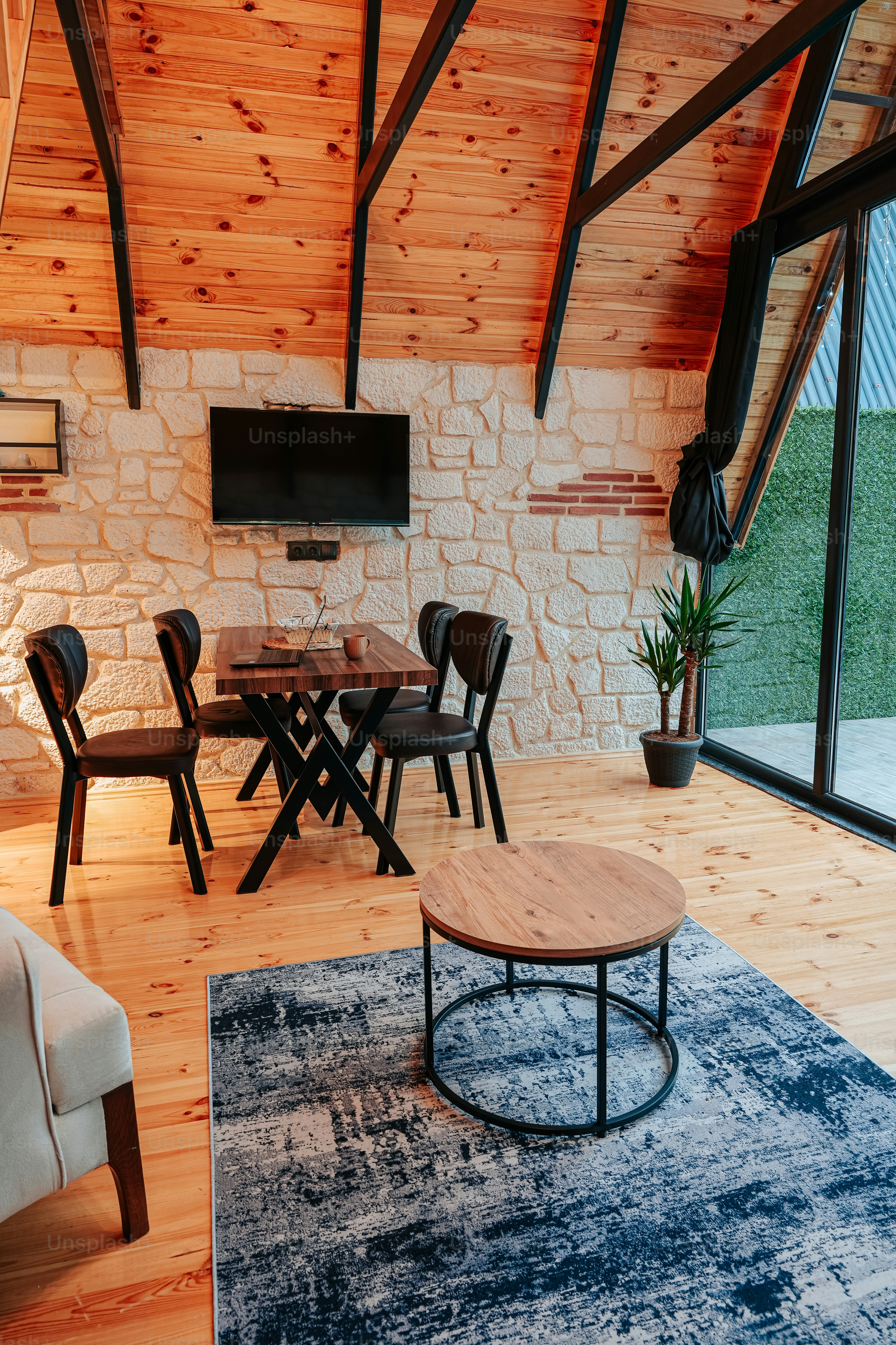 a living room with a couch a table and a tv