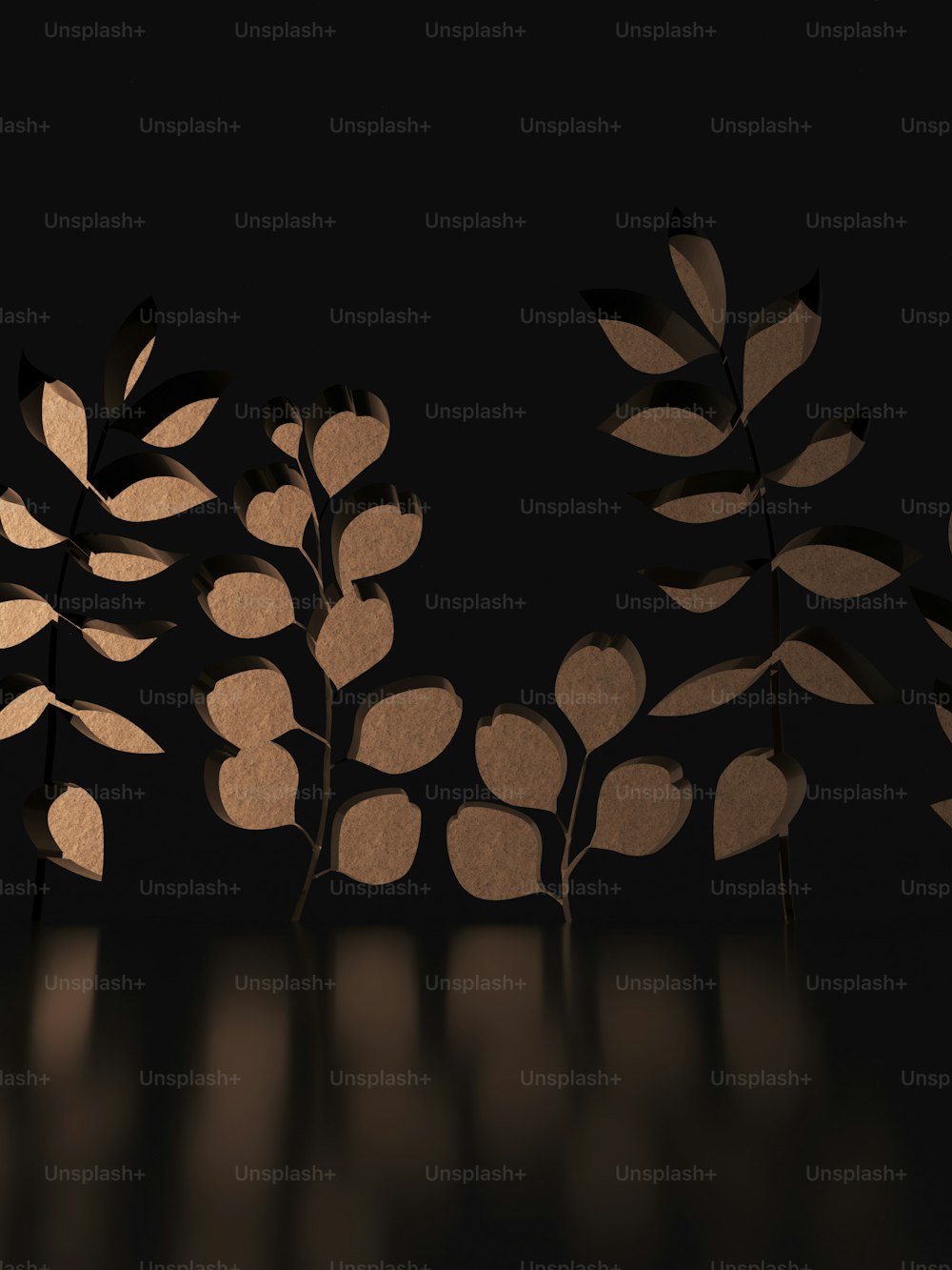 a group of cut out leaves sitting on top of a table