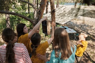 a group of young girls standing next to each other