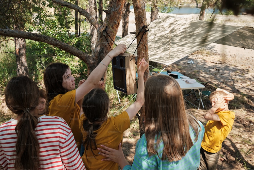 a group of young girls standing next to each other