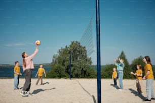 a group of people playing a game of volleyball