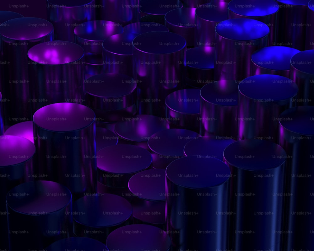 a large group of purple candles sitting on top of a table