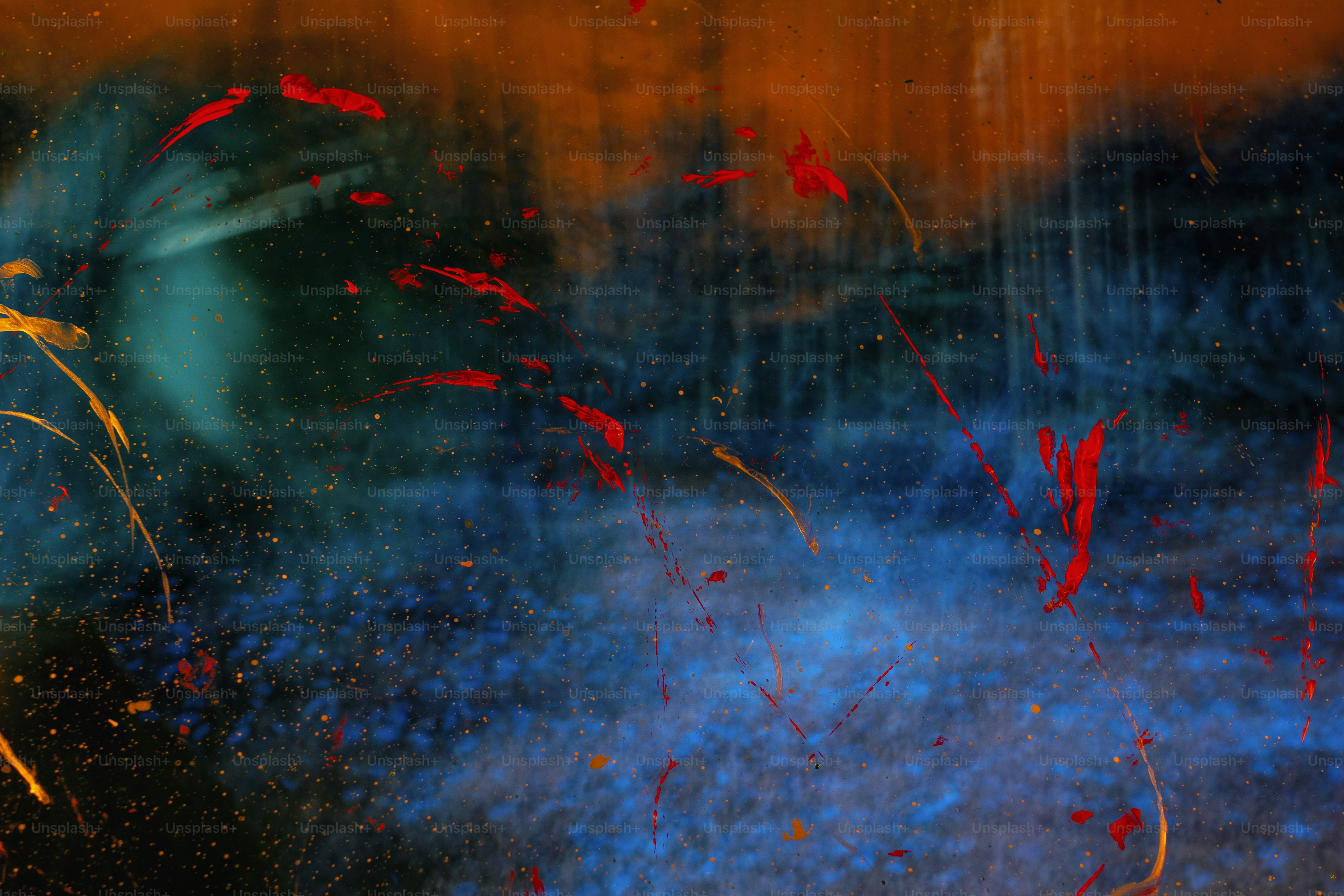 a blurry image of red and blue flowers