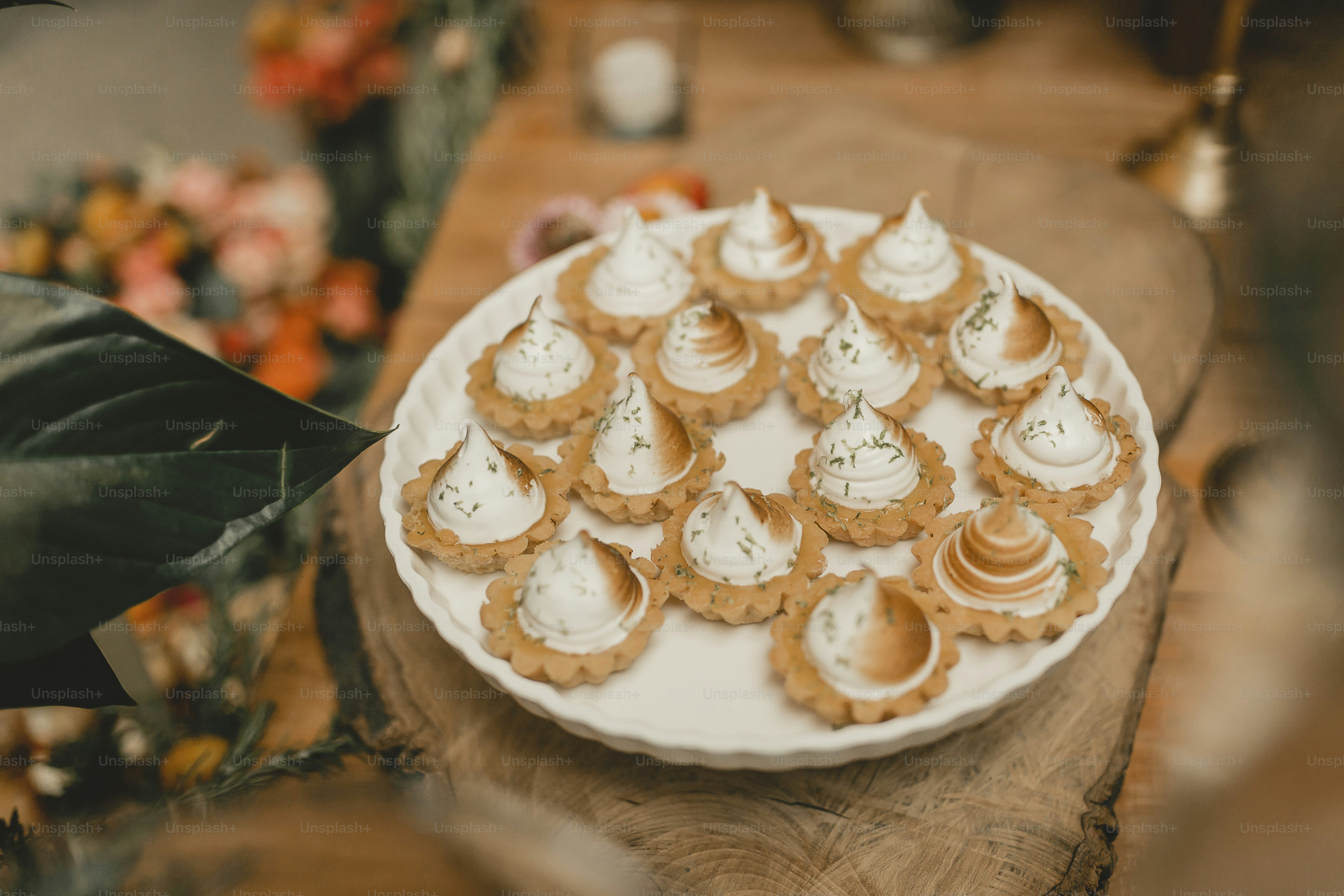 A white plate topped with crackers and cream cheese photo – Food Image ...