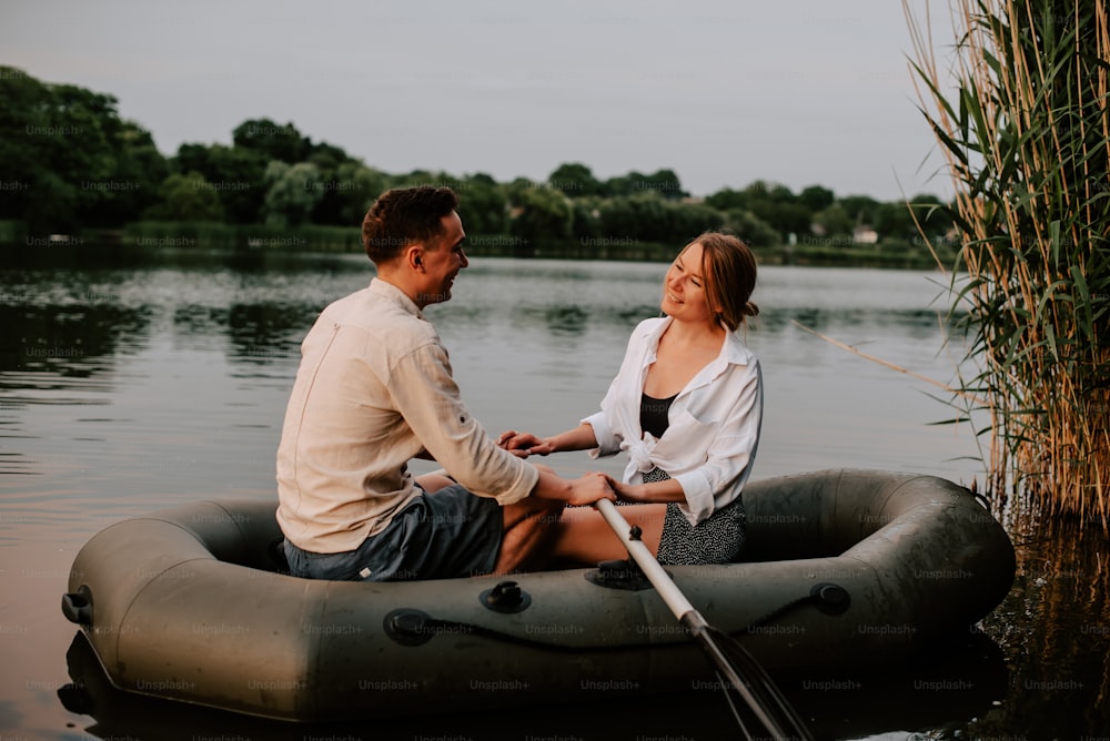 a man and a woman sitting on a raft in the water