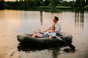 a man and a woman on a raft in the water