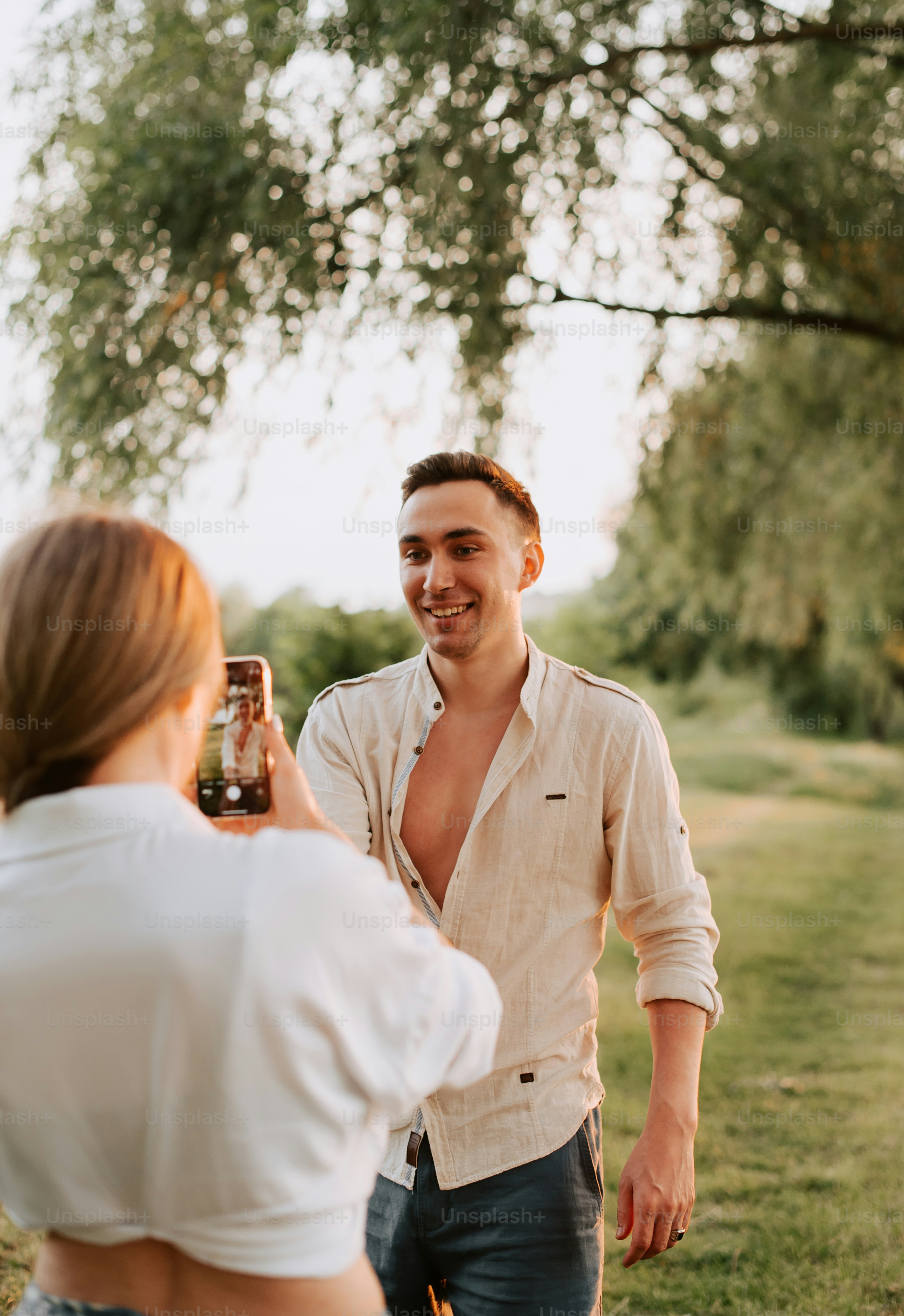 a man holding a beer bottle in his right hand
