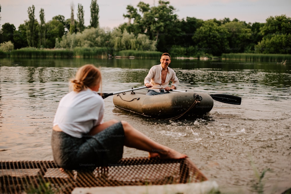 a man and a woman sitting on a raft in the water
